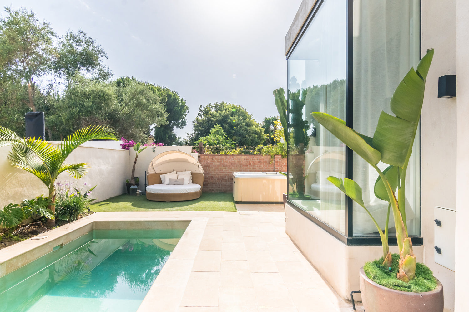 Pool and Jacuzzi of Villa, Marbella luxury Beach House short term rental, located on the beach side at Marbella´s exclusive Golden Mile just steps from the sea